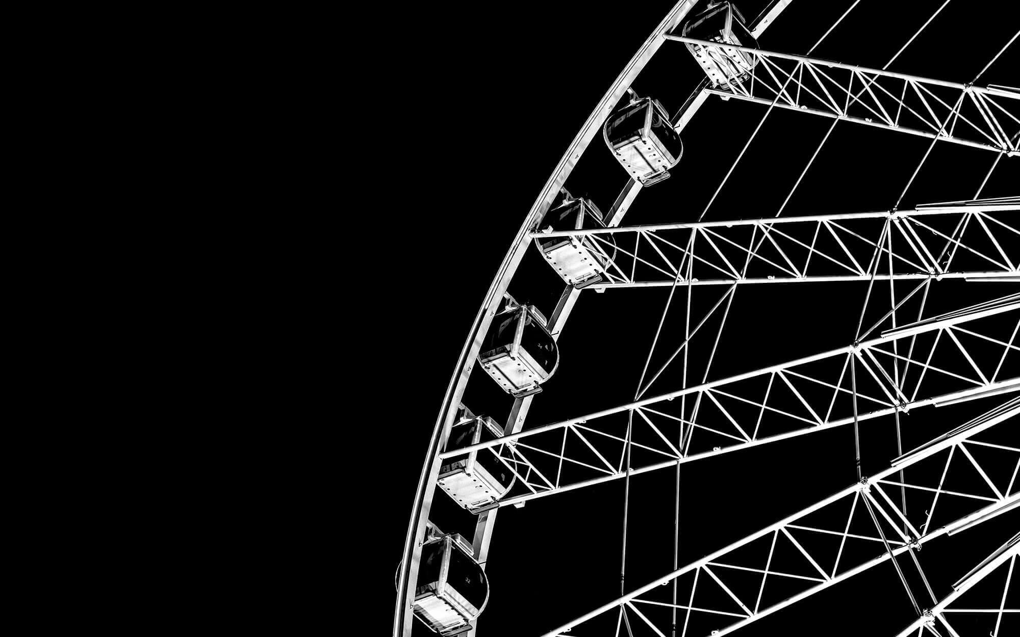 A dramatic image 
                                    of a Ferris wheel.